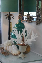corals and seashells placed on the table will make the space look very coastal-like and very chic