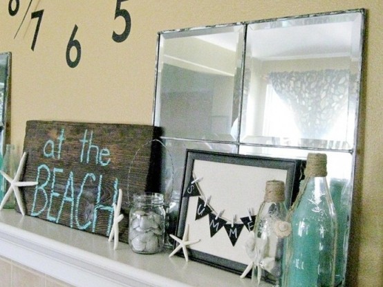starfish and seashells, blue bottles, signs and a burlap garland will make your mantel look beachy and relaxed