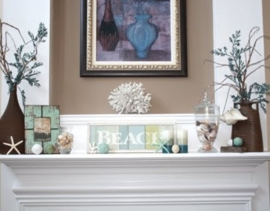 a beachy mantel with striped candles, corals, seashells and starfish, jars with seashells is very cool