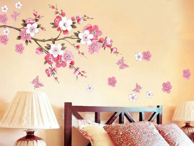 cherry blossom decals accenting the sleeping space is a cool idea for spring and will bring a tender touch to the space