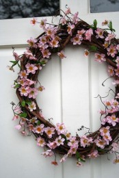 a vine and cherry blossom wreath will make your front door look very spring-like and very chic