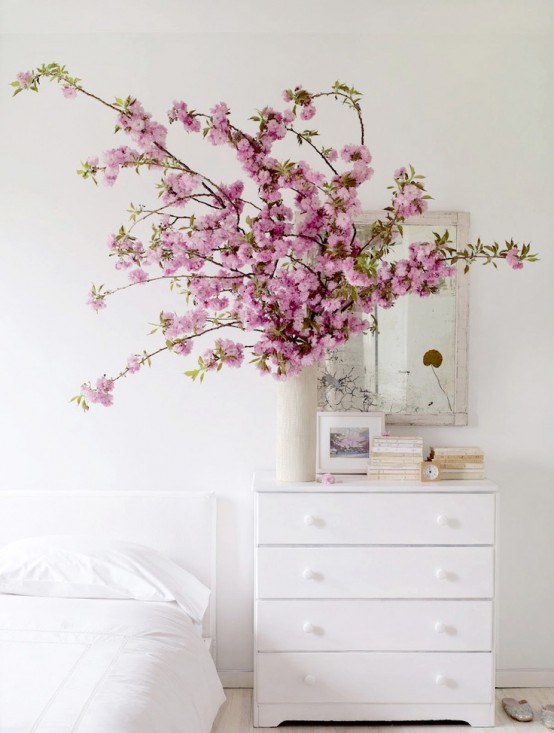 super lush pink blooming branches in a white vase is a cool decoration and centerpiece for spring