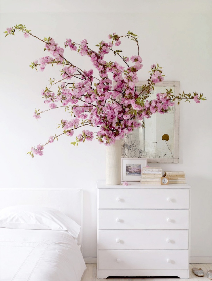 super lush pink blooming branches in a white vase is a cool decoration and centerpiece for spring
