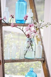 a blue jar with pink cherry blossom is a cool decoration to place it anywhere