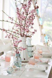 vases with pink cherry blossom are amazing as spring centerpieces or just table decor and they look fresh and romantic
