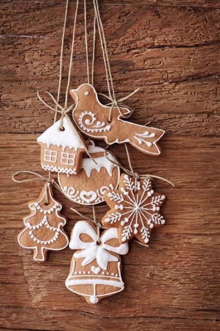 a beautiful Christmas posie made of glazed gingerbread cookies hanging on twine is a pretty rustic decoration for the holidays