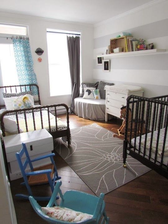 a simple shared space done with brown and blue touches, taupe shades and some floral prints