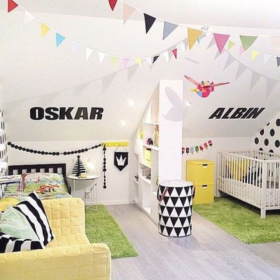 a bright shared space with yellow and green touches and some black and white patterns plus buntings for a cheerful touch