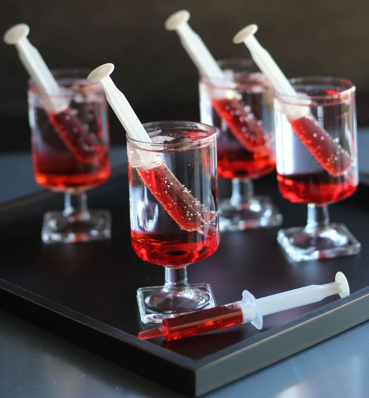 glasses with syringes filled with blood   style your Halloween party drinks like this to make it more fun and bold