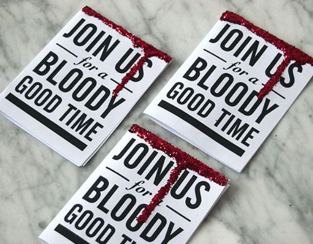 mini black and white invitations with bloody marks are amazing for a modern Dexter themed Halloween party