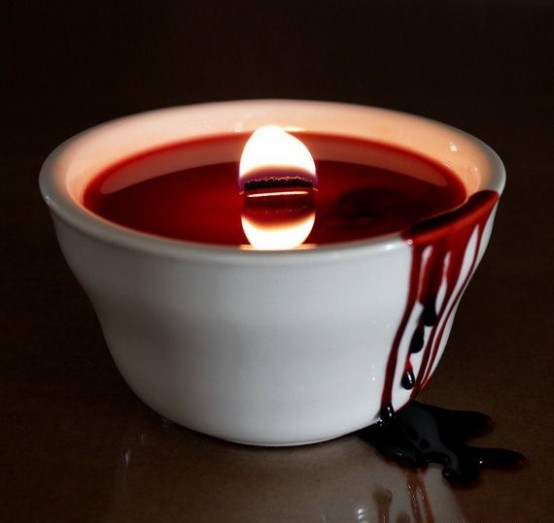 a blood candle in a bowl with dripping is a scary and cool idea for a Dexter-themed Halloween party, make it yourself
