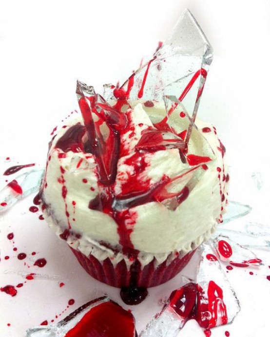 a bloody cupcake with lots of blood and shards is a cool and creative idea for a Halloween party