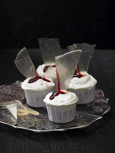 elegant white cupcakes topped with bloody glass shards are classy for any Halloween party, whether it's a Dexter one or not