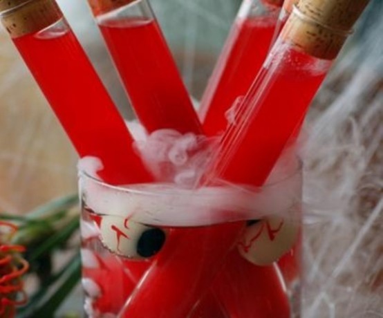 a glass with eyeballs and test tubes with blood is a fun and cool decoration for Halloween parties, not only Dexter-themed ones