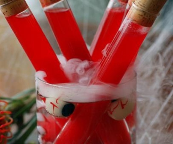 a glass with eyeballs and test tubes with blood is a fun and cool decoration for Halloween parties, not only Dexter themed ones