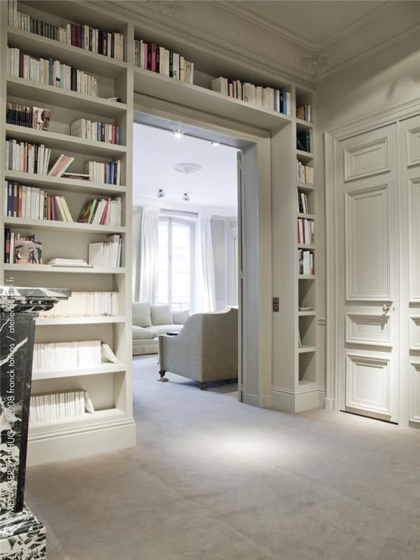 a doorway with built-in open shelves on both sides and over the door is a smart idea to store books and not to place a boring bookshelf somewhere