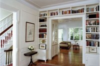 a doorway with built-in shelves is a smart solution to store all the books and give a touch of style to the room at the same time