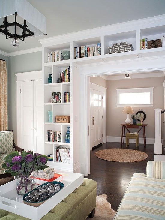 a doorway with built-in shelves is a cool idea to store books and various decor, display them at their best and not to sacrifice any floor space