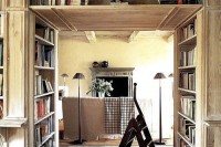 a large shelving unit for books placed in front of a doorway to store a lot of books and use the unused space in front of the doorway