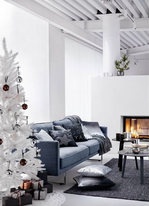 a minimalist living room with a white Christmas tree decorated only with brown and silver sequin ornaments - that's all you need in such a space to create a mood