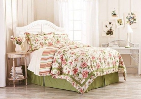 a neutral bedroom with vintage furniture, floral pink and green bedding, blooms and floral prints
