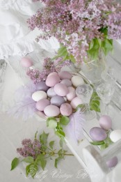 a tender lilac centerpiece and Easter eggs in matching purple and lilac shades