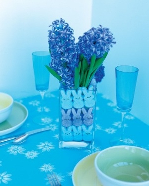 a simple Easter centerpiece of bunnies and purple grape hyacinths