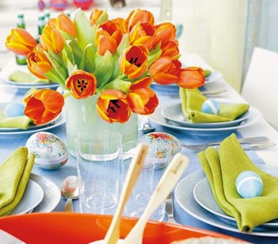 a pastel vase with orange tulips is a simple and cool Easter centerpiece