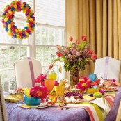 a colorful Easter centerpiece with red tulips and lilac for bright decor