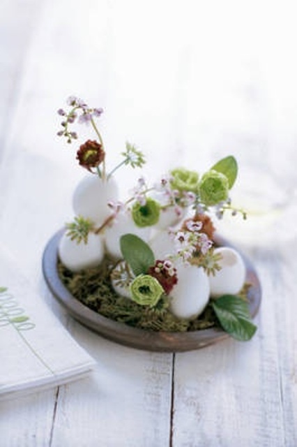 Lily Of The Valley And Lisianthus In Eggs On Moss