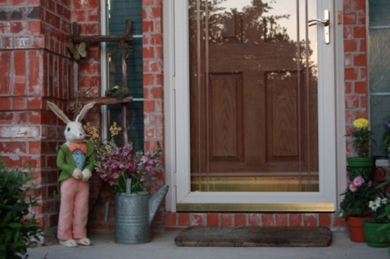 potted blooms, a floral arrangement in a watering can and toy bunny in a suit