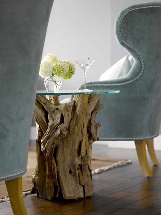 an elegant and all-natural side table made of driftwood and a glass tabletop is a lovely idea for a beach or coastal space, and you can DIY it easily