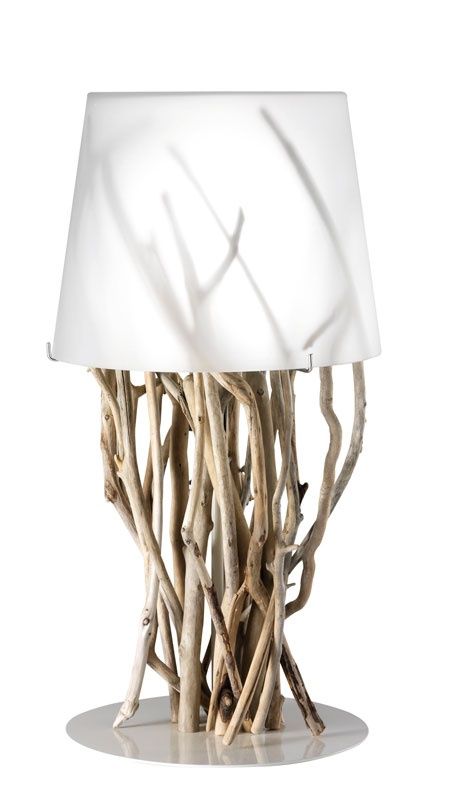 a modern and lovely table lamp of driftwood as a base and a white, semi sheer lampshade is a veyr fresh and eco friendly idea