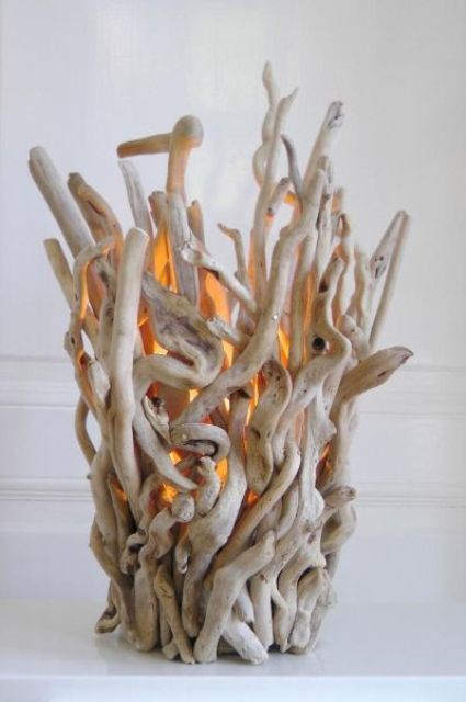 a pretty and cool candleholder fully composed of driftwood pieces is a lovely idea for a beach or coastal interior and you may use it outdoors, too