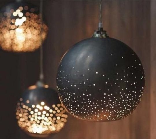 cool black and gold perforated pendant lamps are a lovely idea for any space and they will make your space look festive and very refined