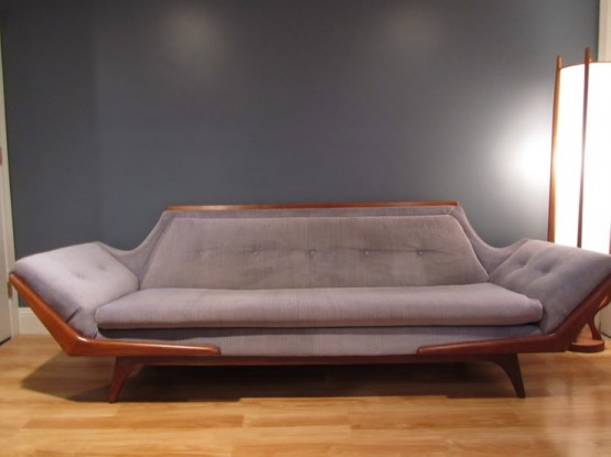 a refined grey lavender sofa with a rich-stained frame is a catchy idea for a mid-century modern space
