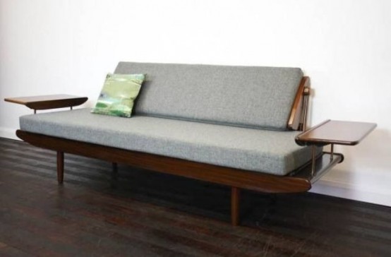 a grey mid-century modern sofa with a dark-stained frame and armrests is a catchy and bold idea for a mid-century modern space