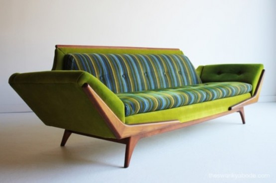 a bright green and blue mid-century modern sofa with a stained frame is a catchy and colorful idea for a modern space