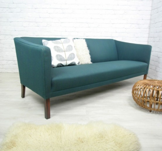 a blue mid-century modern sofa is a catchy and bold addition to any living room, it's a stylish and timeless solution
