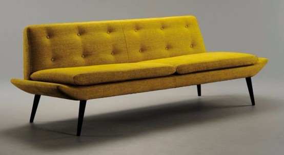a mustard mid-century modern sofa with a visible base is a catchy idea to style your space as a boho or mid-century modern one