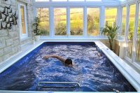 even a small sunroom extension could fit a pool where you can swim like pro