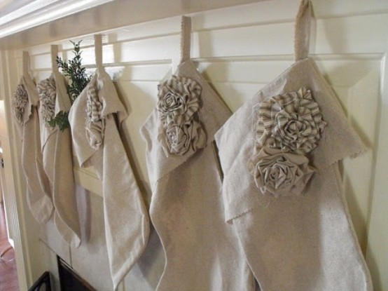 neutral burlap stockings with ruffle flowers are amazing for vintage-inspired Christmas decor