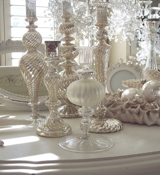 lots of white and mercury glass candleholders are amazing for Christmas decor and white ornaments ina  tray add to it
