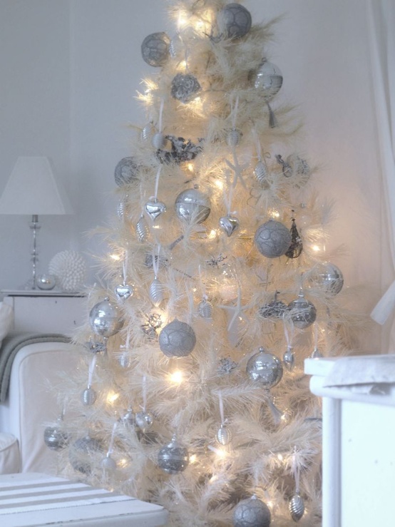 a magical white Christmas tree with lots of silver and white ornaments and lights is a very enchanting decor idea for a vintage space