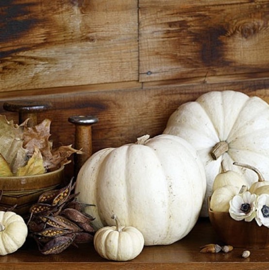 put white pumpkins, white blooms and fall leaves and berries to create a simple and natural fall decoration