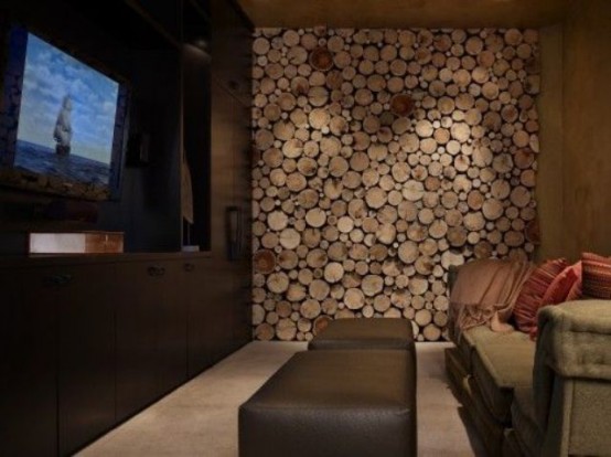 a wood slice accent wall makes the living room rustic and cozy and hides a non-working fireplace at the same time