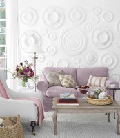 a fantastic white 3D wall done with eceiling medallions attached to it and painted adds refined chic