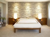 a faux stone statement wall is easier to install than a real one and will add a cozy rustic feel to the bedroom