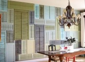 an accent wall all clad with colorful vintage shutters is a very bold and chic solution for the space