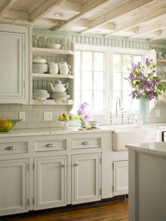 a neutral vintage kitchen with pane cabinets, a white stone countertops, a white subway tile backsplash, mint green backsplash and open shelves is cool